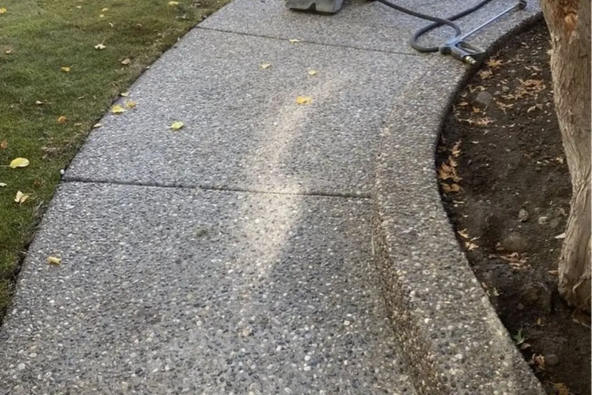 Curved exposed aggregate concrete walkway installation