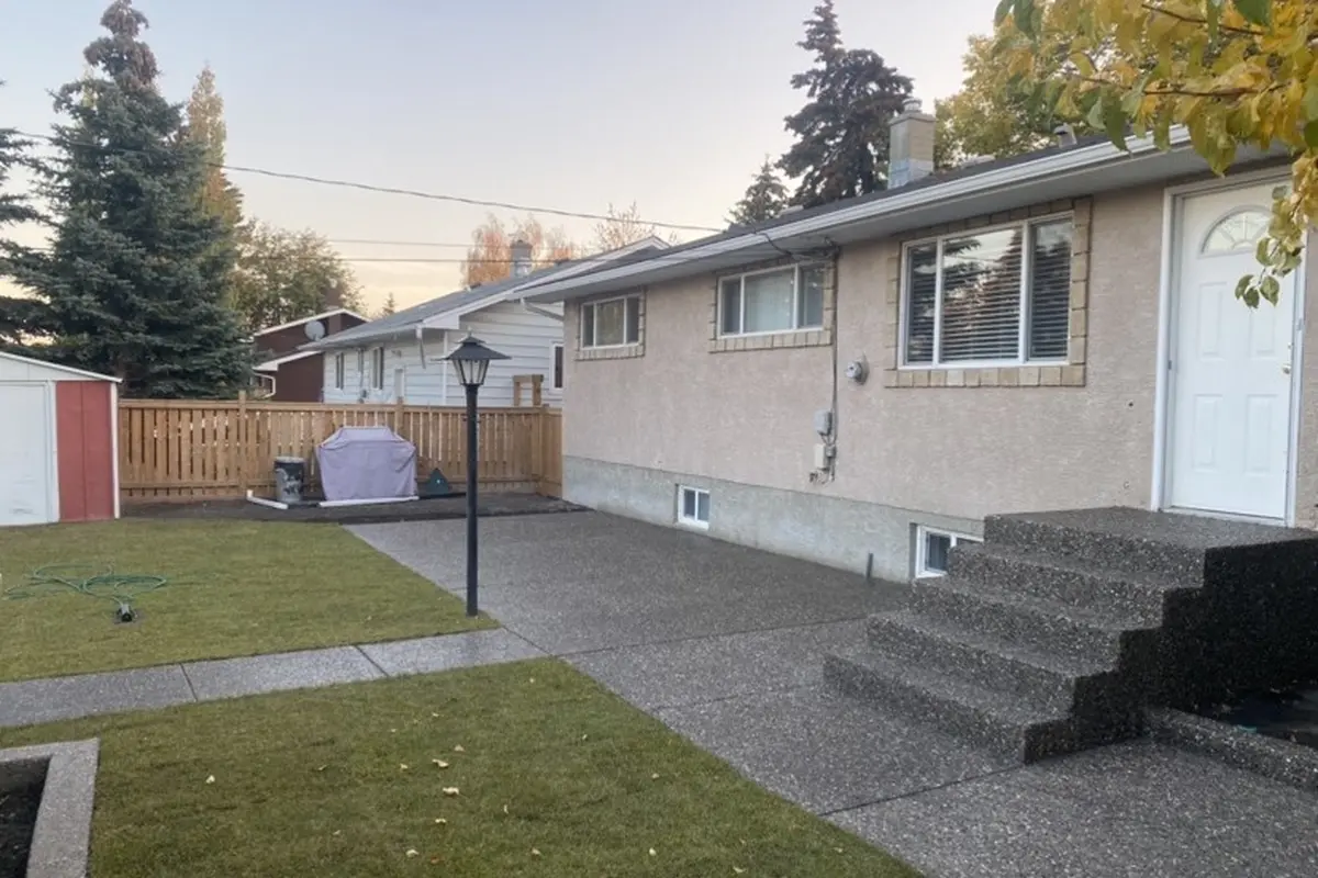 Exposed aggregate concrete yard steps landscaping Calgary