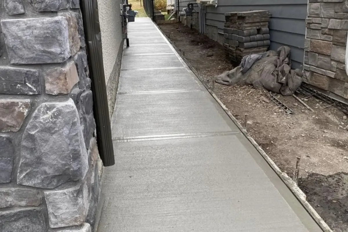 Calgary side yard concrete walkway with broom finish