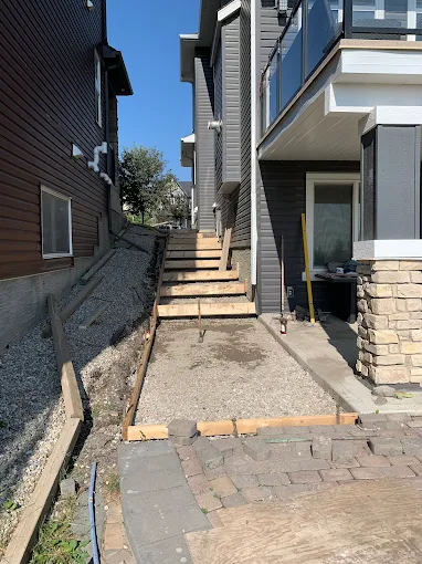 Side yard walkway + steps prep in Calgary — AACWORKX Concrete & Landscaping